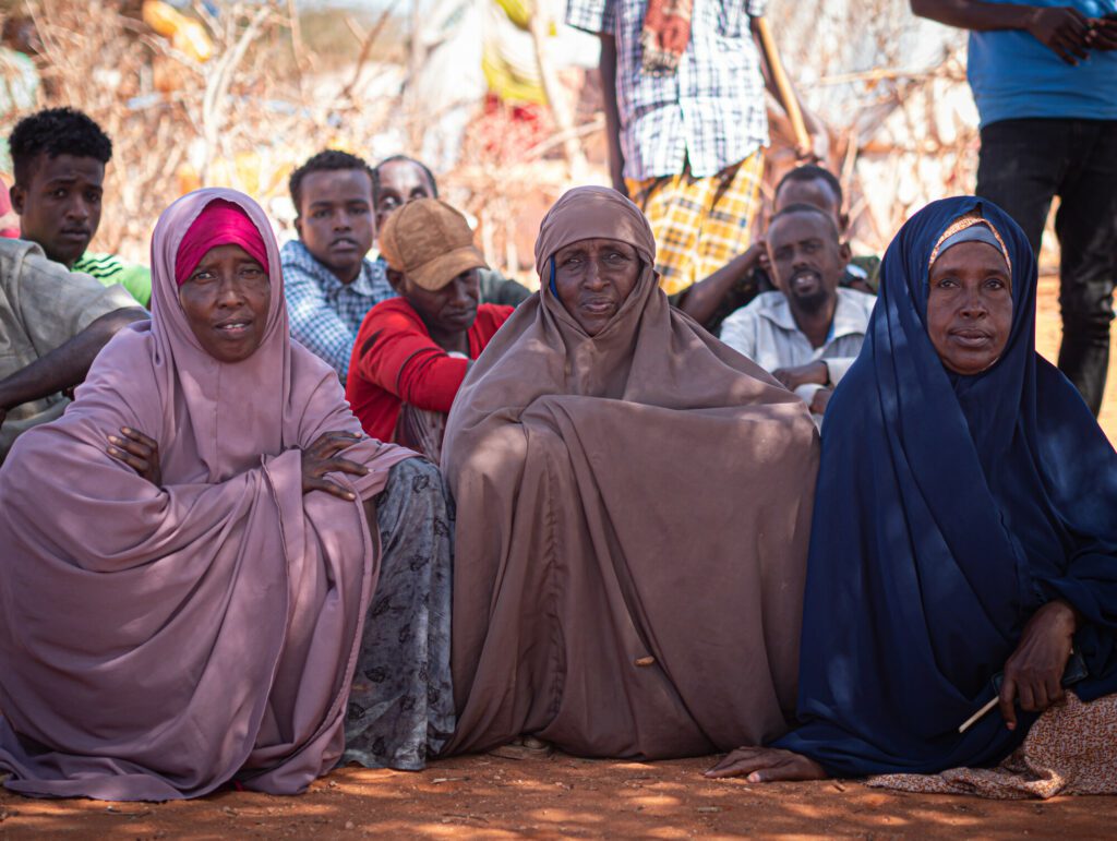 Women and men in an IDP Settlement in Southern Somalia