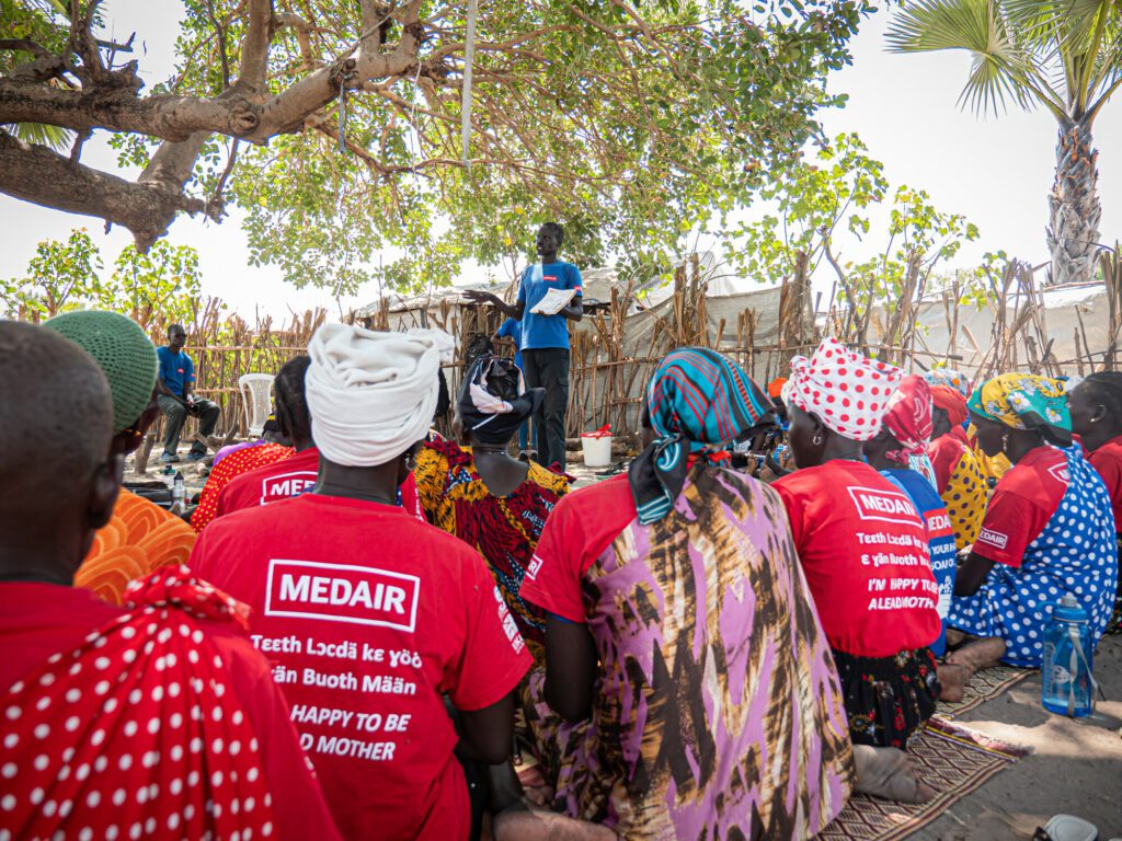 Humanitarian Aid Worker shares health messages with women in South Sudan.
