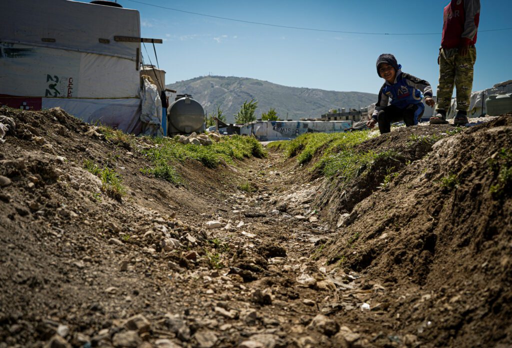 Close up of a drainage ditch at an informal settlement in the Bekaa Valley.