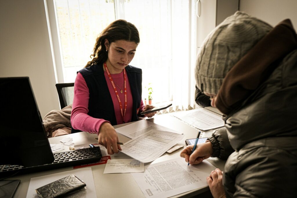 Marichka, Medair`s Assistant is registering an IDP