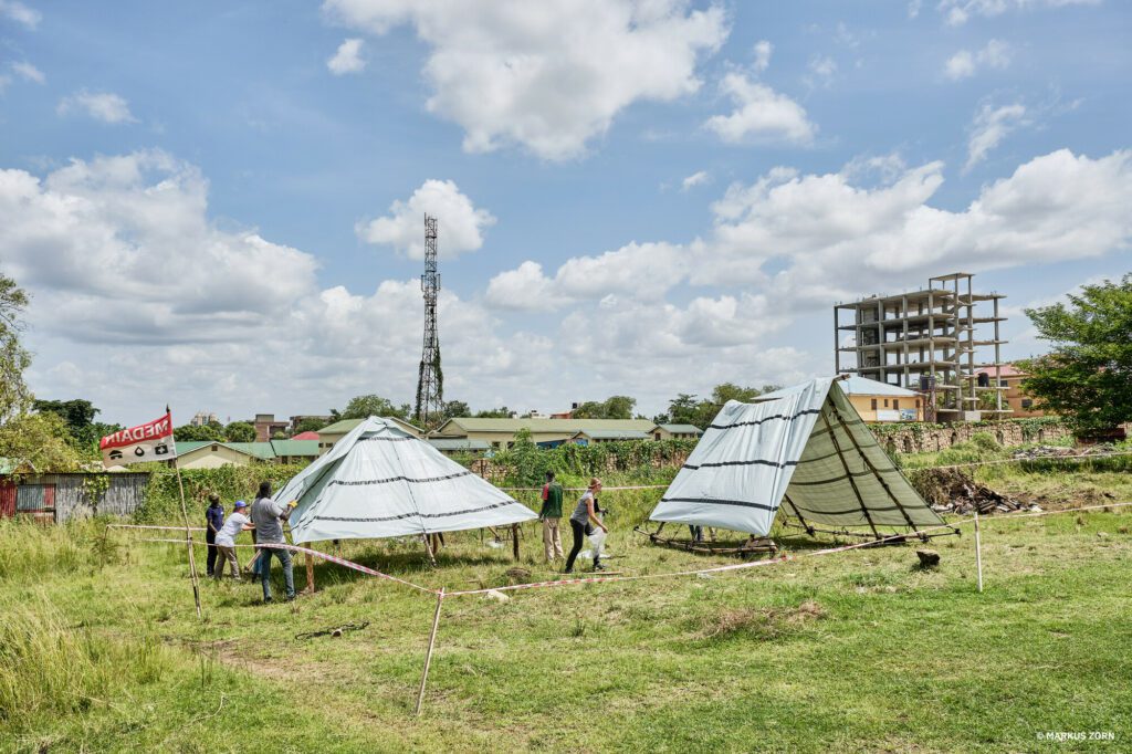 Flood resilient shelter and roof construction on grass at the compound of the University of Juba.