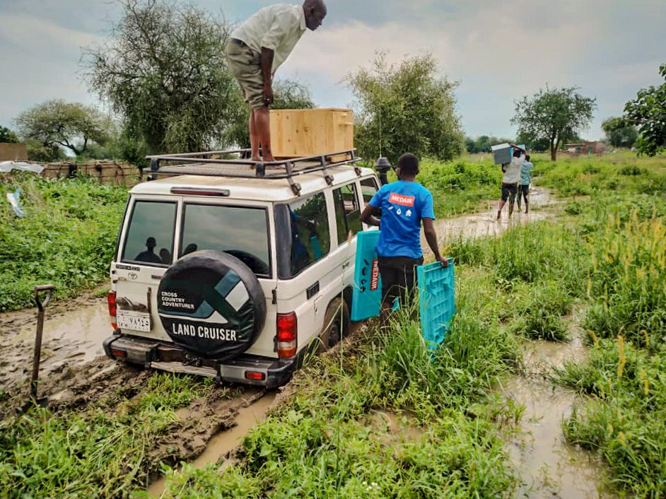 A car of humanitarian agency gets stuck in the mud in Blue Nile, Sudan.