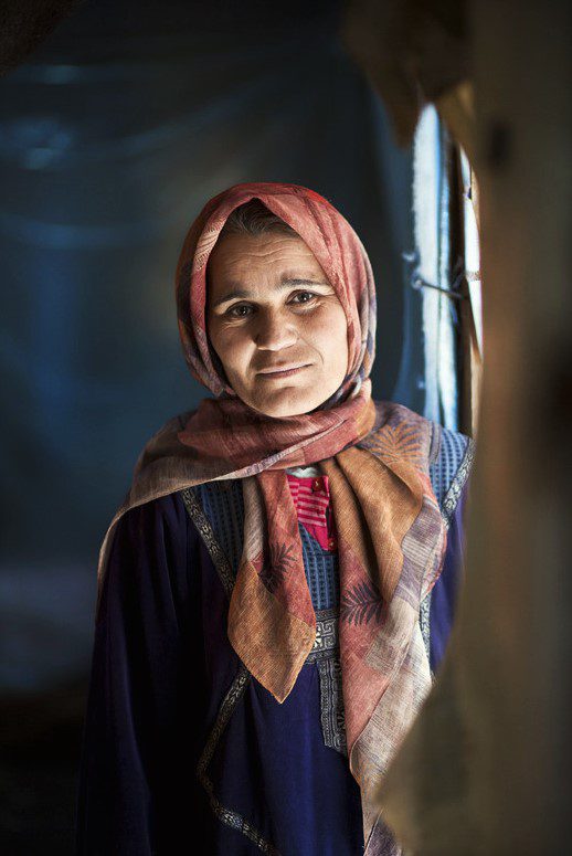 Portrait of a Syrian women - now a refugee - inside her shelter home, constructed out of plastic and vinyl sheeting, in Lebanon's Bekaa Valley. For any usage of this point outside of Medair: Please contact Conny Sjberg at Lakarmissionen, 08-620 02 00.