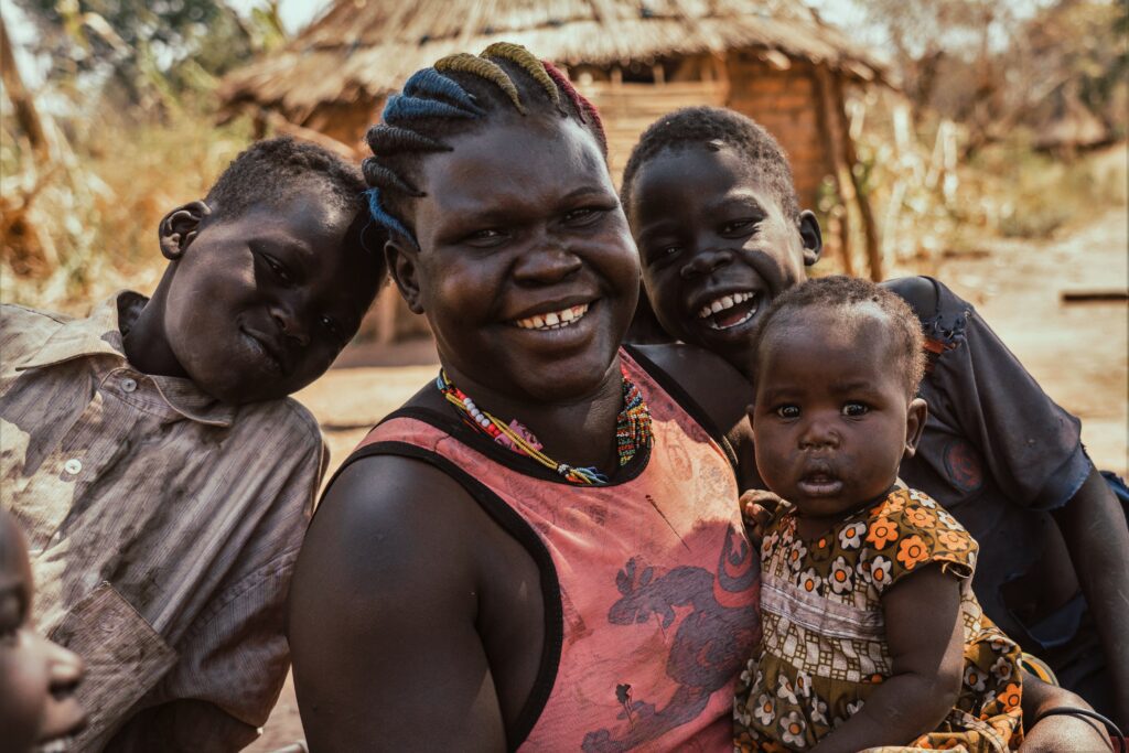 A woman with children in her community in South Sudan
